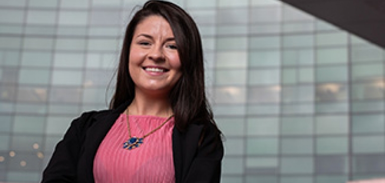 Female Boler College of Business Graduate at her place of employment